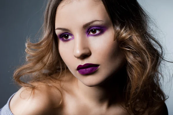 Elegant fashionable woman with violet visage — Stock Photo, Image