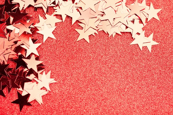 Festlig stjärnor på röd bakgrund — Stockfoto
