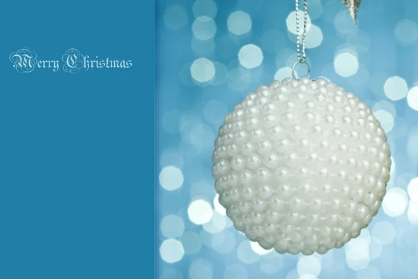 Christmas ball on sparkles background — Stok fotoğraf