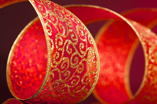 Red and golden bow on background — Stock Photo, Image