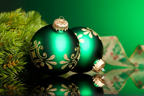 Branch of Christmas tree with festive ball — Stock Photo, Image