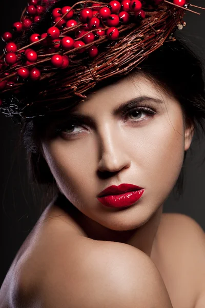 Woman with wreath of european holly — Stock Photo, Image