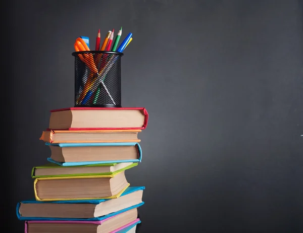 Books on the background of the school board — Stock Photo, Image