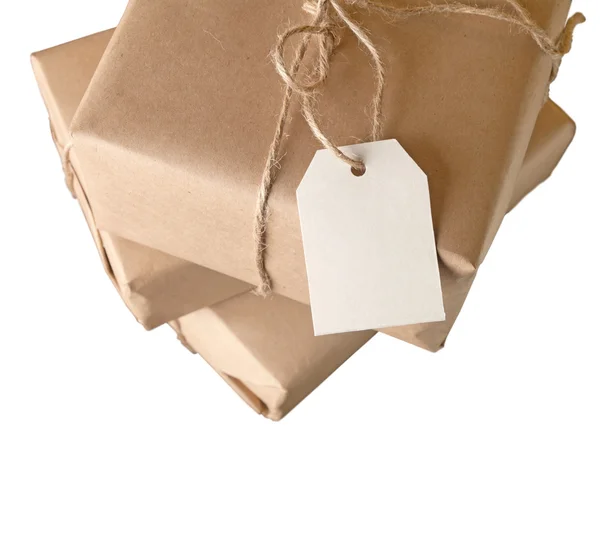 Parcel wrapped with brown paper tied with rope isolated on white background — Stock Photo, Image