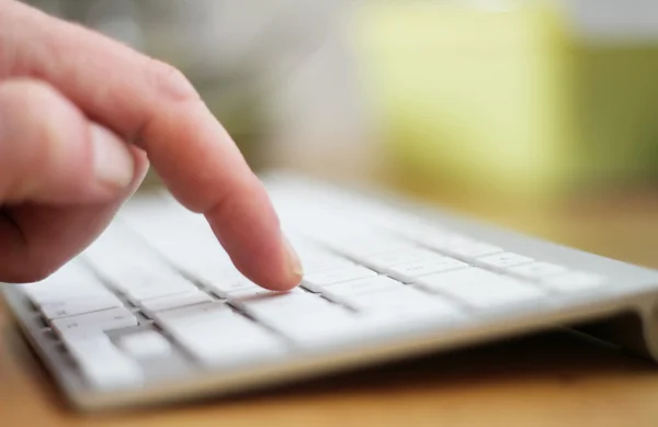 Hand typing on keyboard — Stock Photo, Image