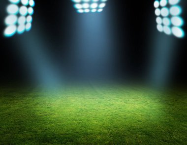 yeşil futbol sahası ve parlak ışıklar