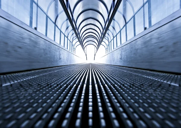 Symmetric escalator inside contemporary airport — Stock Photo, Image