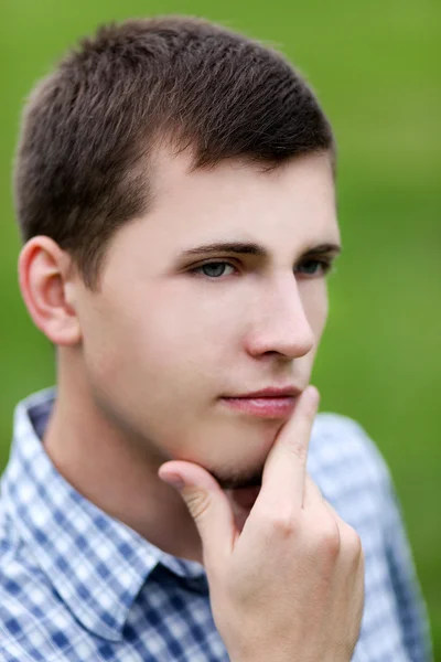 Active smiling young man enjoying in nature — Stock Photo, Image