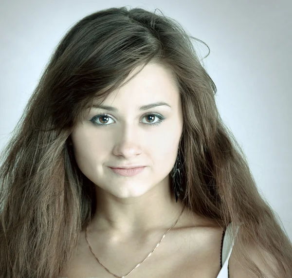 Emotional portrait of cute young girl with beautiful brown hair — Stock Photo, Image