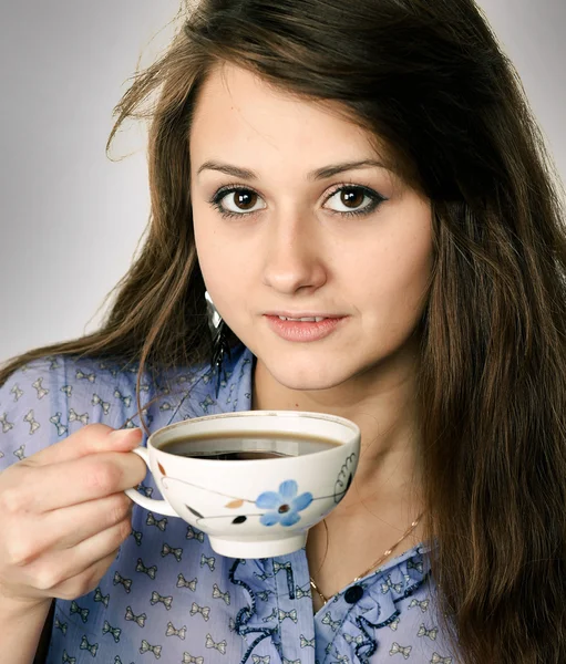 Beautiful brunette lady drinking bracing coffee — Stock Photo, Image