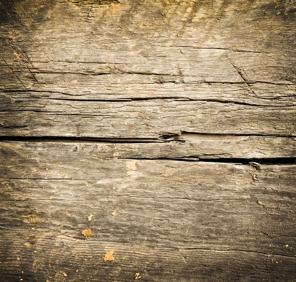 Closeup of dark grungy wooden desk — Stock Photo, Image