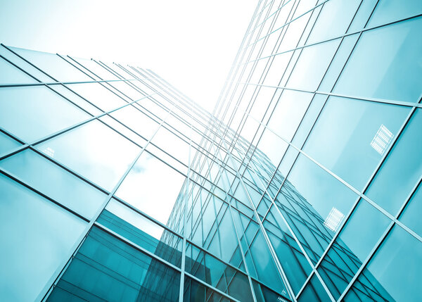 Glassy texture of tilt view to contemporary turquoise glass business center