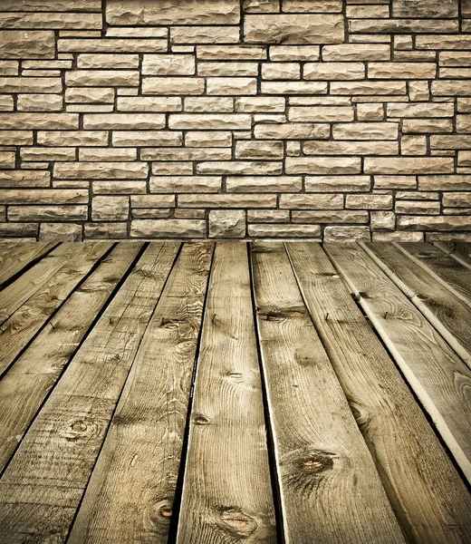 Grungy muro di pietra e pavimento in legno — Foto Stock