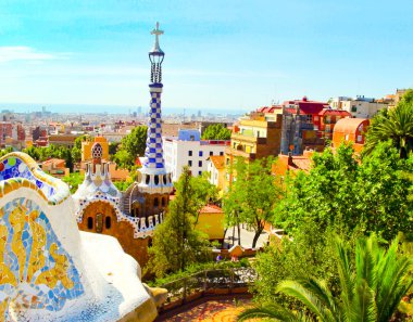 The Famous Summer Park Guell over bright blue sky in Barcelona, Spain clipart