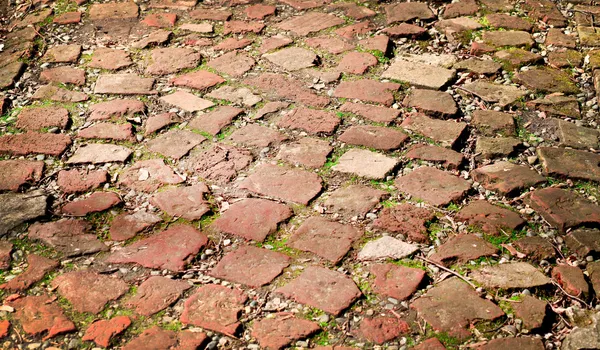 Grungy red brick and stone sett — Stock Photo, Image