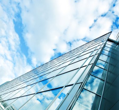 Bakış açısı geniş açı cam yüksek artış gökdelenler bina çelik mavi arka plana görüntülemek