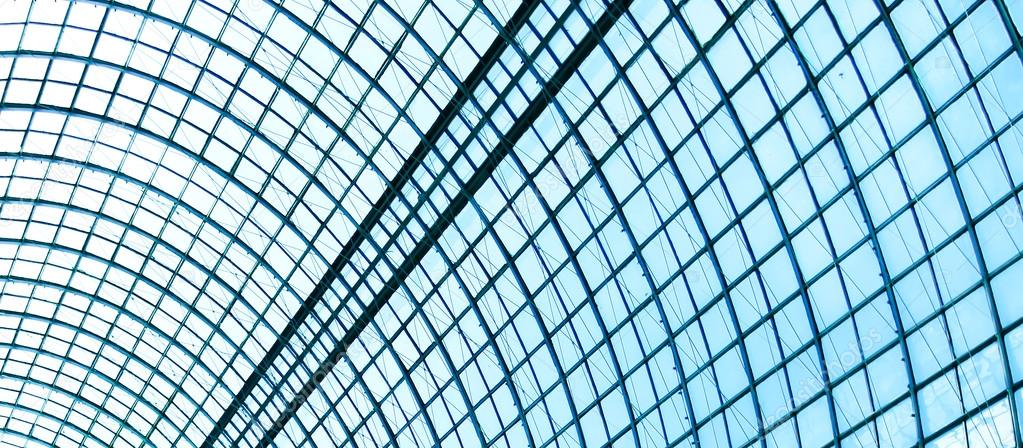 View to steel blue glass airport ceiling through high rise building skyscrapers
