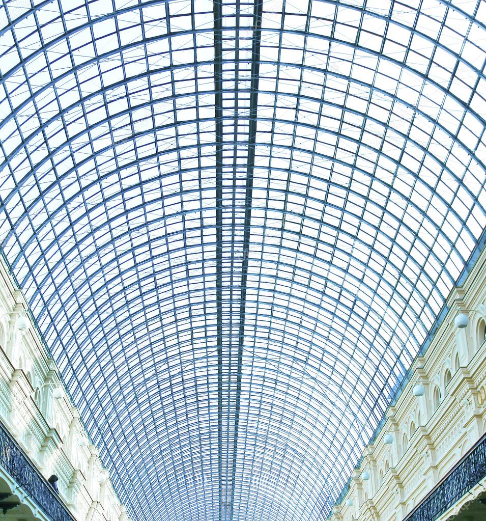 View to steel blue glass airport ceiling through high rise building skyscrapers