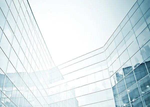 Panoramic and perspective wide angle view to steel blue background of glass high rise building skyscrapers in modern futuristic downtown at night Business concept of successful industrial architecture — Stock Photo, Image