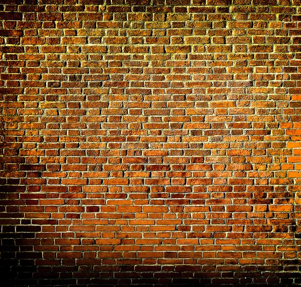 Grungy texturizado parede de pedra vermelha dentro de idade negligenciada e deserta — Fotografia de Stock