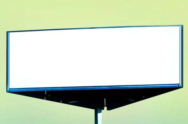 Wide white background of illuminated big blank billboard — Stock Photo, Image