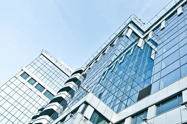 Panoramic and perspective wide angle view to steel blue background of glass high rise building skyscrapers in modern futuristic downtown at night Business concept of successful industrial architecture — Stock Photo, Image