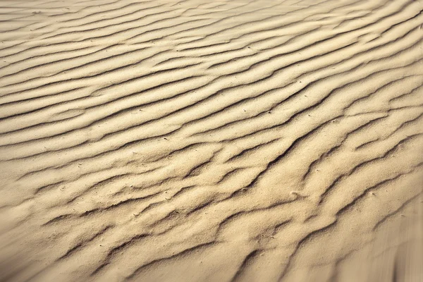 Gebobbeld textuur van zand strand — Stockfoto