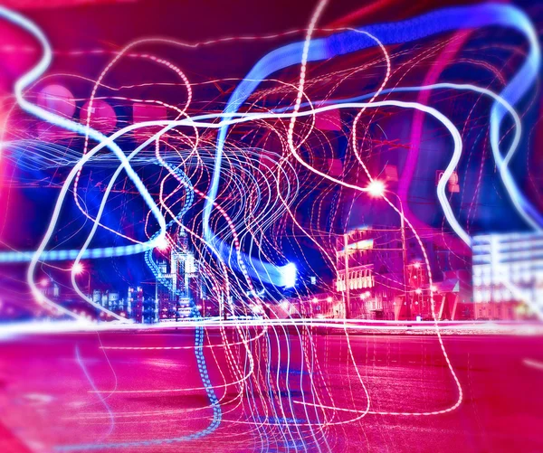 Colorful ribbons over night streets — Stock Photo, Image