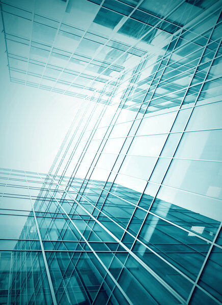 Panoramic and prospective wide angle view to steel light blue background of glass high rise building skyscraper commercial modern city of future. Business concept of successful industrial architecture