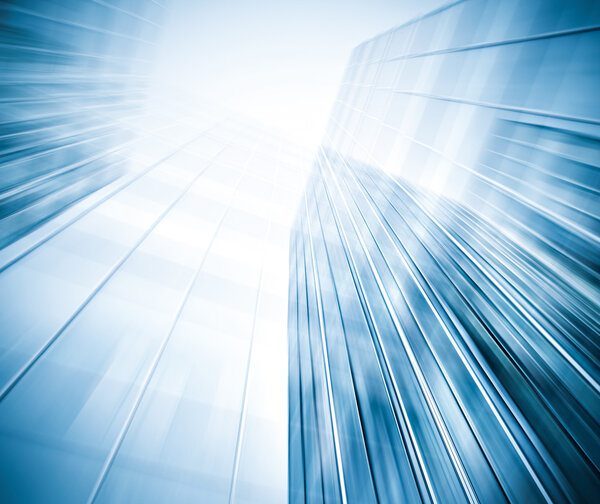 Panoramic and prospective wide angle view to steel light blue background of glass high rise building skyscraper commercial modern city of future. Business concept of successful industrial architecture