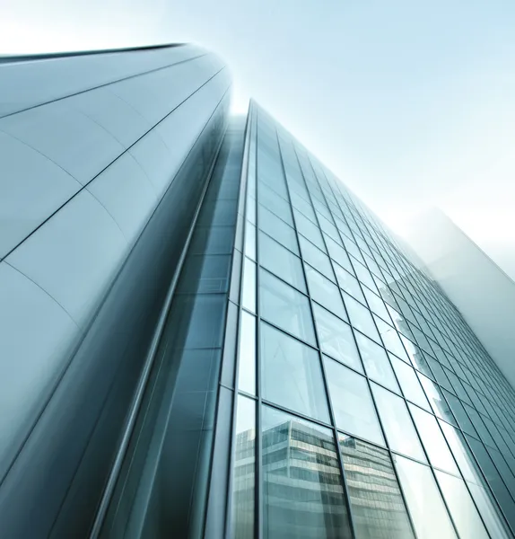 Panoramic and prospective wide angle view to steel light blue background of glass high rise building skyscraper commercial modern city of future. Business concept of successful industrial architecture — Stock Photo, Image