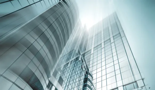 Panoramic and prospective wide angle view to steel light blue background of glass high rise building skyscraper commercial modern city of future. Business concept of successful industrial architecture — Stock Photo, Image