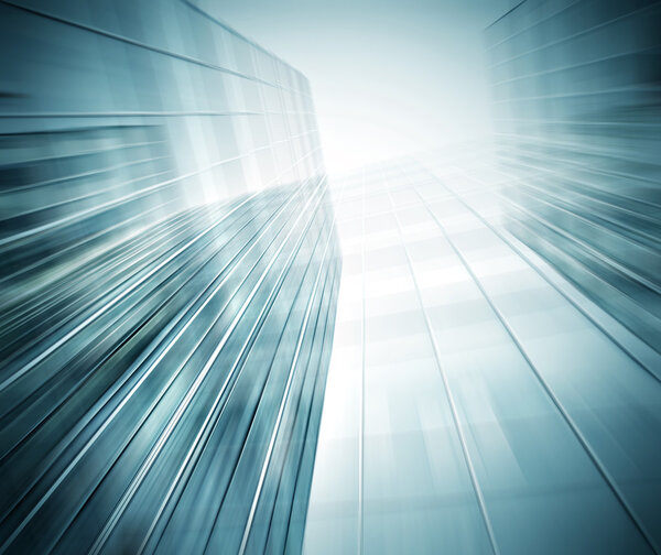 Panoramic and prospective wide angle view to steel light blue background of glass high rise building skyscraper commercial modern city of future. Business concept of successful industrial architecture