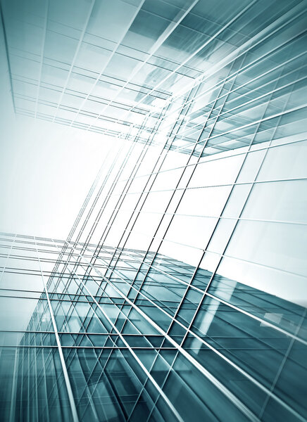 Panoramic and prospective wide angle view to steel light blue background of glass high rise building skyscraper commercial modern city of future. Business concept of successful industrial architecture