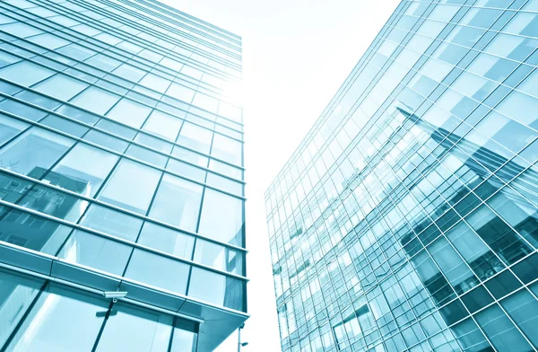 Panoramic and prospective wide angle view to steel light blue background of glass high rise building skyscraper commercial modern city of future. Business concept of successful industrial architecture — Stock Photo, Image