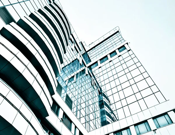 Panoramic and prospective wide angle view to steel light blue background of glass high rise building skyscraper commercial modern city of future. Business concept of successful industrial architecture — Stock Photo, Image