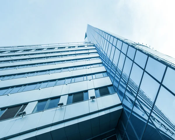 Panoramic and prospective wide angle view to steel light blue background of glass high rise building skyscraper commercial modern city of future. Business concept of successful industrial architecture — Stock Photo, Image