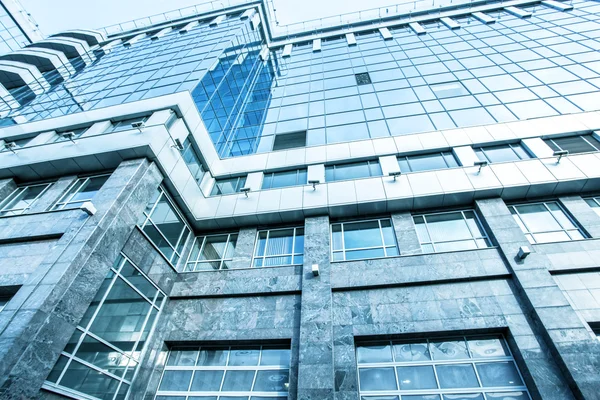 Panoramic and prospective wide angle view to steel light blue background of glass high rise building skyscraper commercial modern city of future. Business concept of successful industrial architecture — Stock Photo, Image