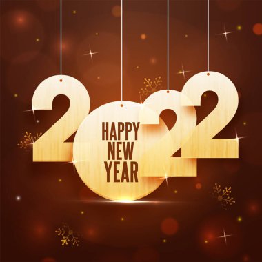 Altın 2022 Numara Kahverengi Bokeh Işıkları Üzerine Kar Taneleriyle Takıl Efekti.