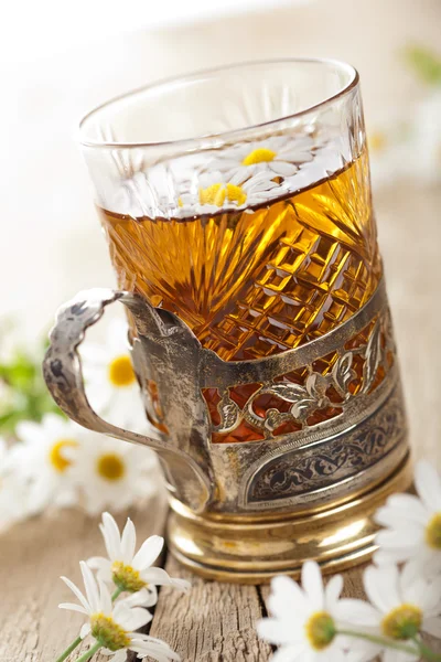 Cup of herbal tea with chamomile flowers — Stock Photo, Image