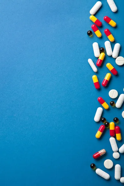 Pills border over blue — Stock Photo, Image