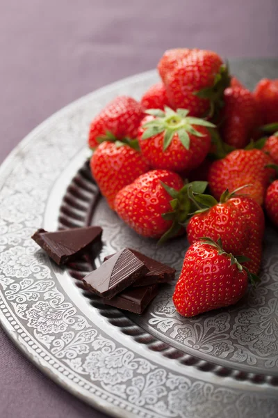 Strawberry and chocolate on vintage plate — Stock Photo, Image