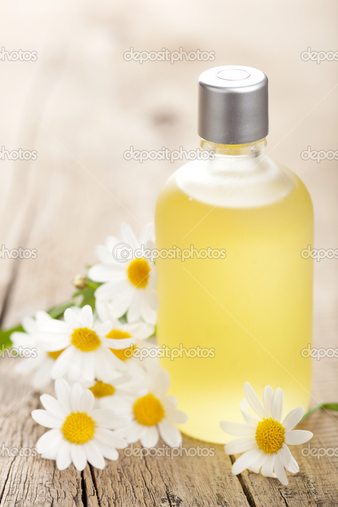 essential oil and chamomile flowers