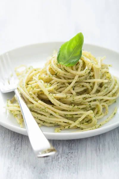 Spaghetti with pesto sauce Stock Photo
