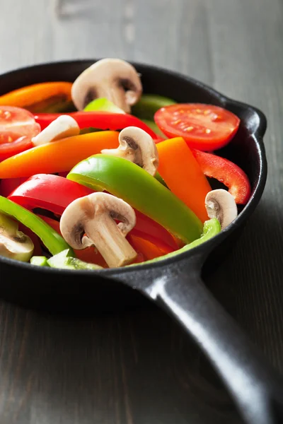 Colorful vegetables in black pan ready for frying — Stock Photo, Image