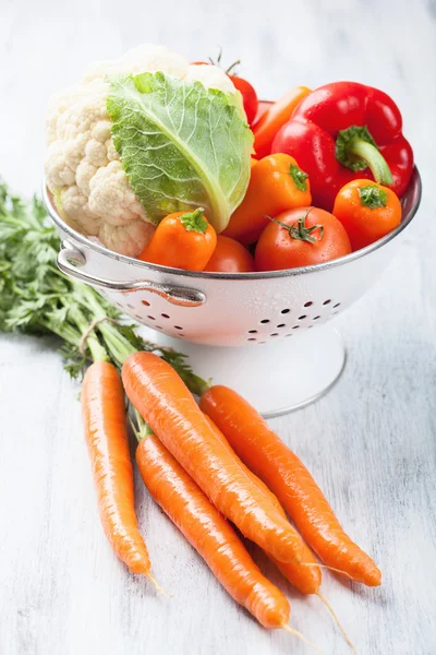 Colorful vegetables in colander — Stock Photo, Image