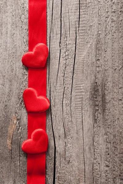 Red hearts and ribbon frame wooden background for Valentines — Stock Photo, Image