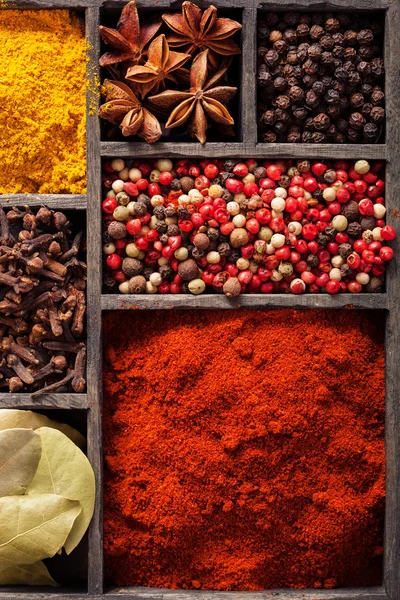 Spices in box pink and black pepper ground paprika curry ani — Stock Photo, Image