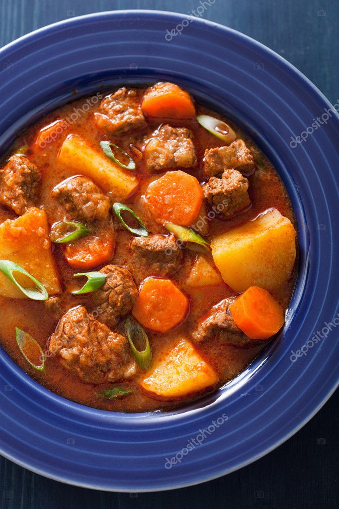 Beef stew with potato and carrot in blue plate Stock Photo by ©duskbabe 42950013