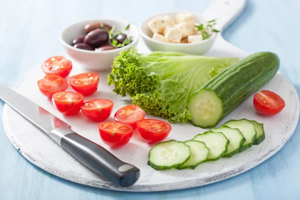 Ingredients for salad with tomatoes cucumber olives and feta che — Stock Photo, Image